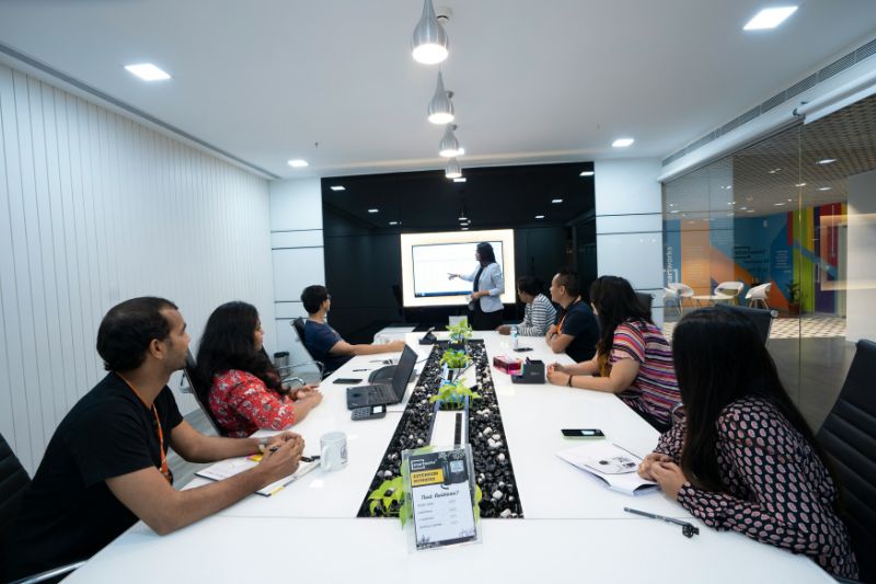 Team collaborating around a table in a modern office