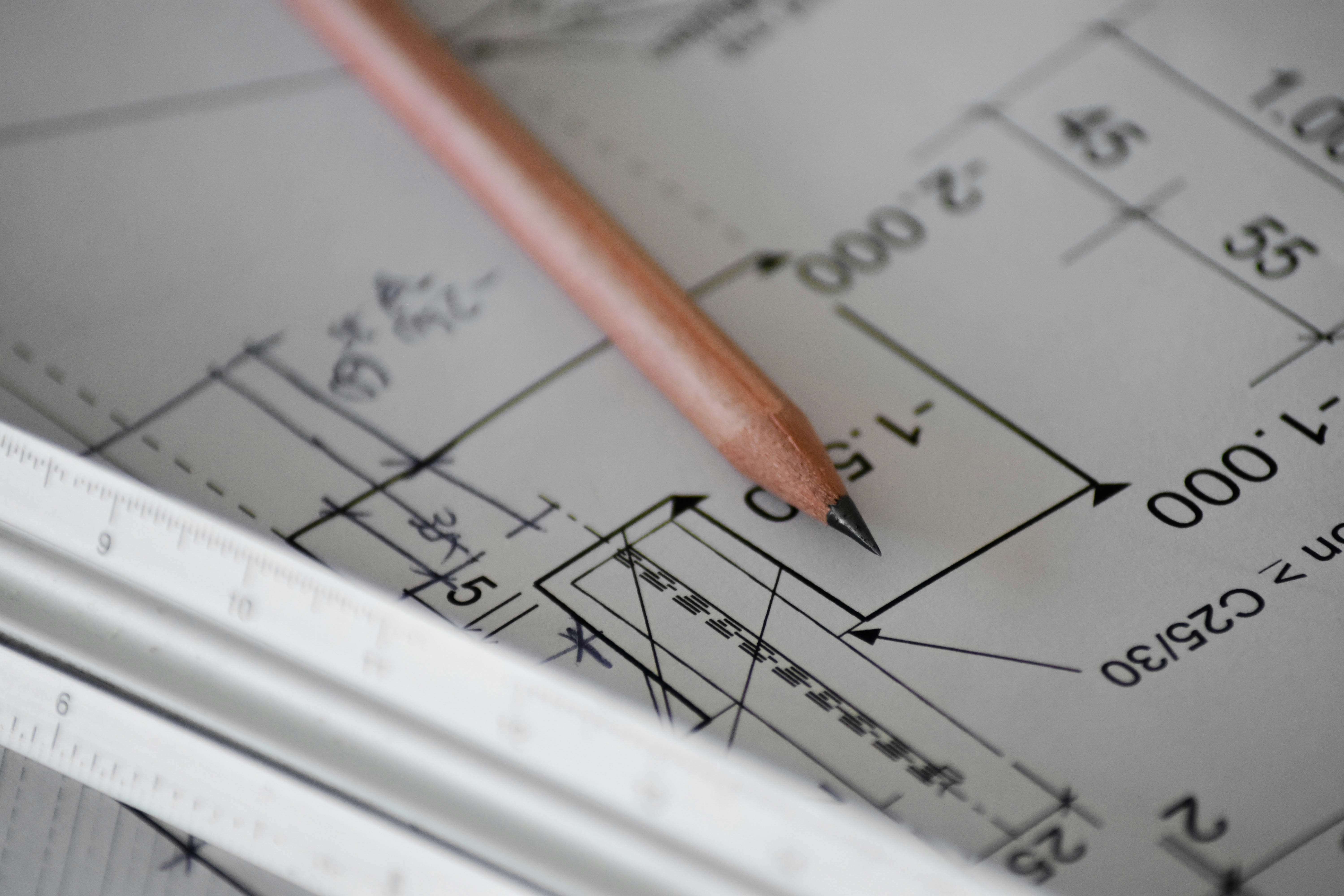 Pencil and ruler on a design blueprint